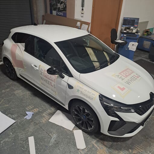 An image of the My Four Wheels car before FASTSIGNS signage.